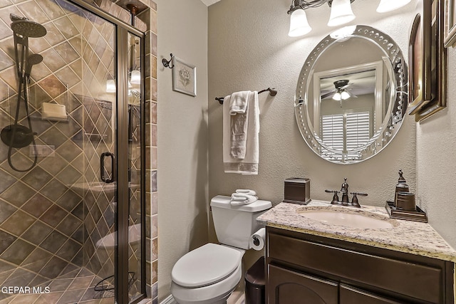 bathroom featuring vanity, toilet, and walk in shower