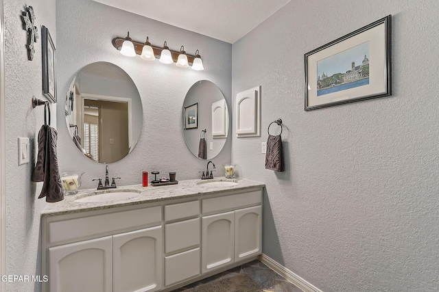 bathroom with tile patterned flooring and vanity