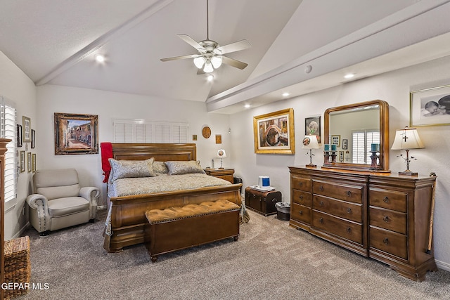 carpeted bedroom with multiple windows, ceiling fan, and lofted ceiling