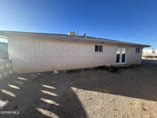 rear view of property featuring french doors