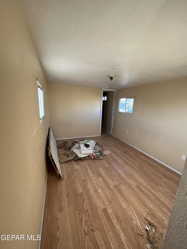 spare room featuring light hardwood / wood-style floors