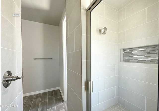 bathroom featuring an enclosed shower and hardwood / wood-style flooring