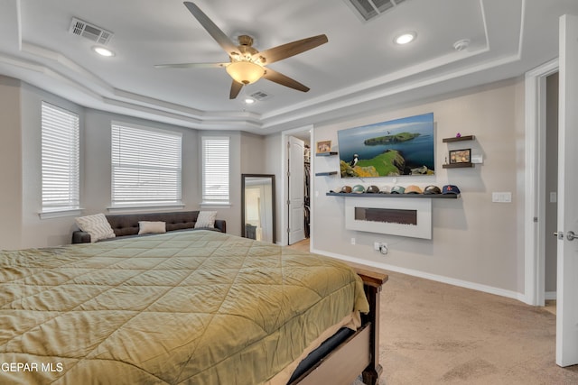 912 Crystal Deer Dr, El Paso, TX 79928 - carpeted bedroom with ceiling fan, a walk in closet, ornamental molding, and a tray ceiling