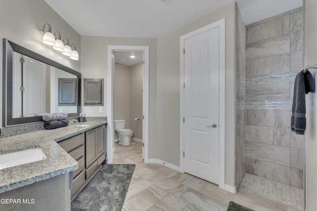 912 Crystal Deer Dr, El Paso, TX 79928 - bathroom with tiled shower, vanity, and toilet