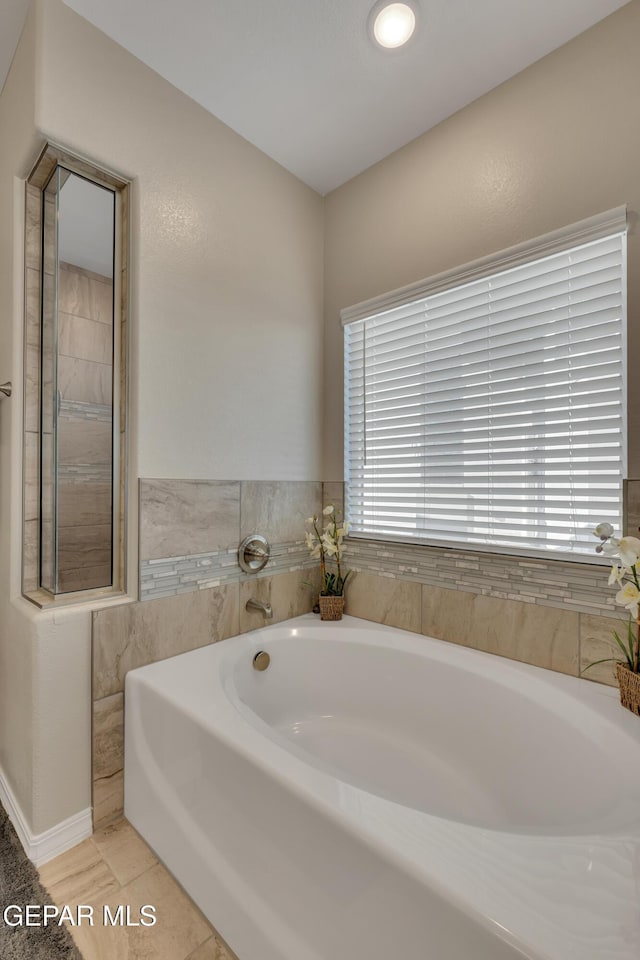 912 Crystal Deer Dr, El Paso, TX 79928 - bathroom with a bath and tile patterned floors