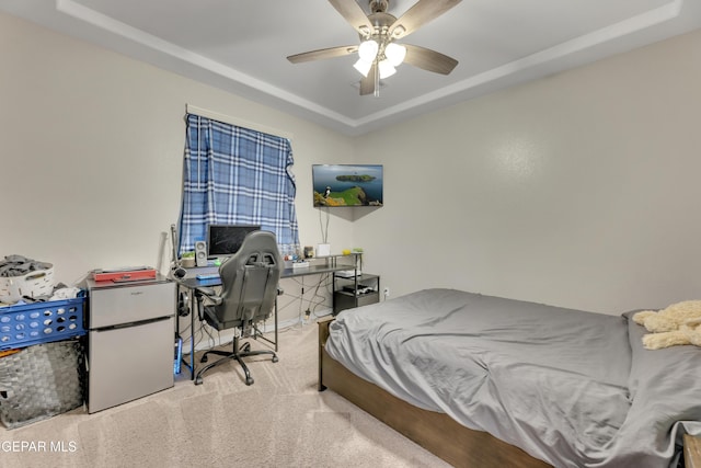 912 Crystal Deer Dr, El Paso, TX 79928 - carpeted bedroom featuring a tray ceiling, refrigerator, an office area, and ceiling fan