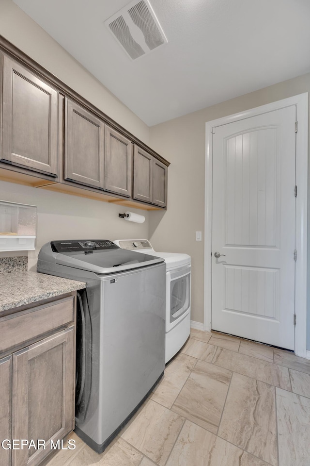 912 Crystal Deer Dr, El Paso, TX 79928 - clothes washing area with washing machine and dryer and cabinets