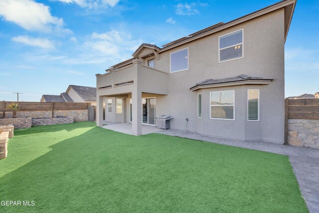 912 Crystal Deer Dr, El Paso, TX 79928 - rear view of house with a lawn, a patio area, and a balcony