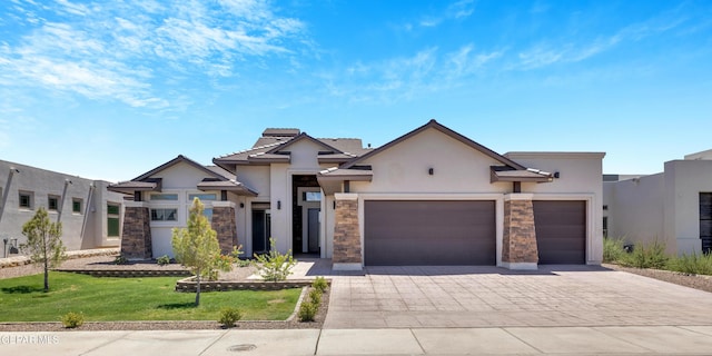 view of front facade featuring a front yard and a garage