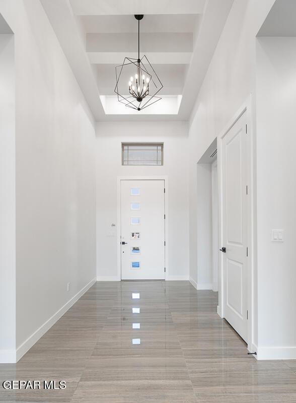 foyer with a chandelier