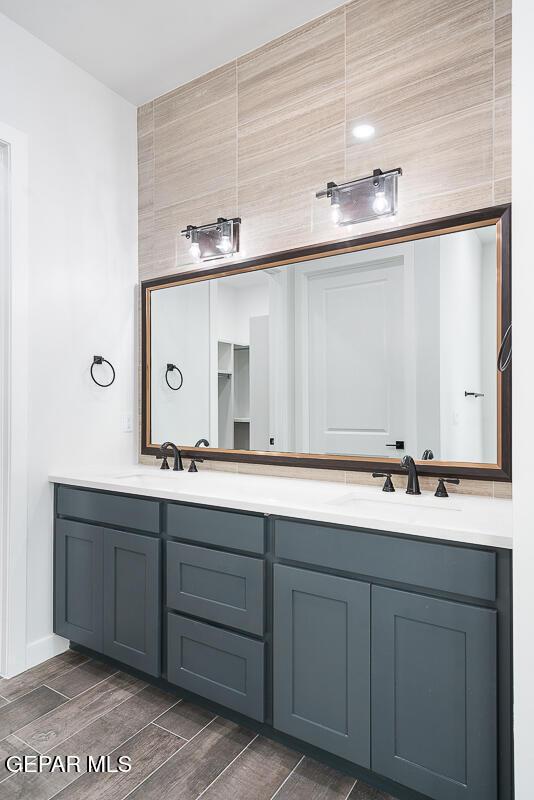 bathroom featuring vanity and wood-type flooring