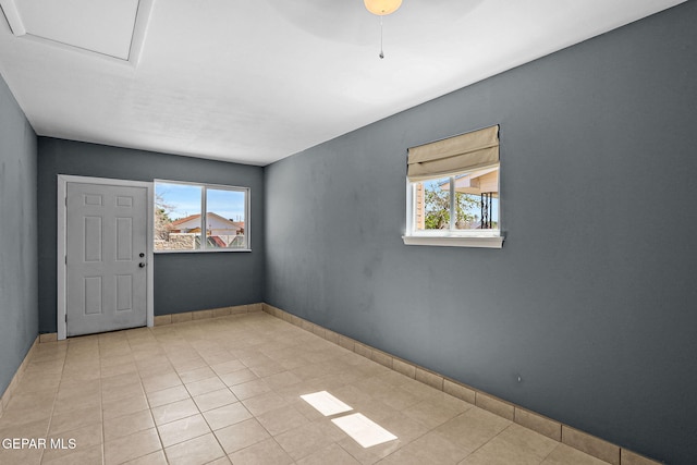 spare room featuring light tile patterned floors