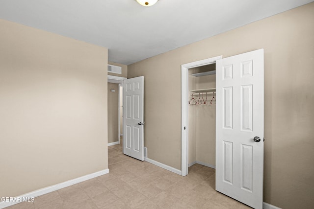 unfurnished bedroom with a closet