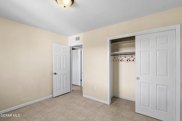 unfurnished bedroom featuring a closet