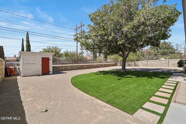 view of yard with a storage shed