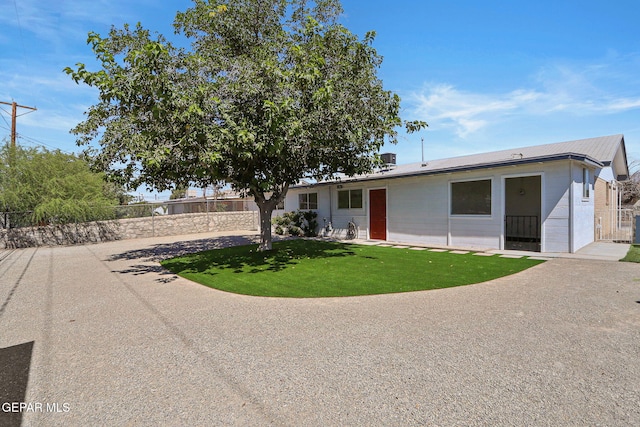 view of front of home with a front lawn