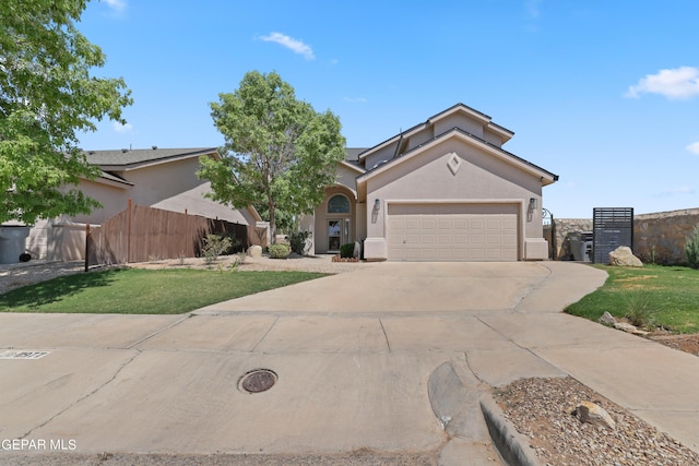 view of front of house with a front lawn and a garage