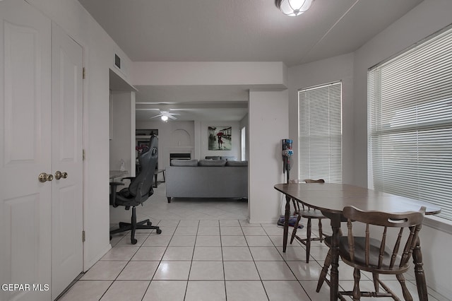 office featuring ceiling fan and light tile patterned floors