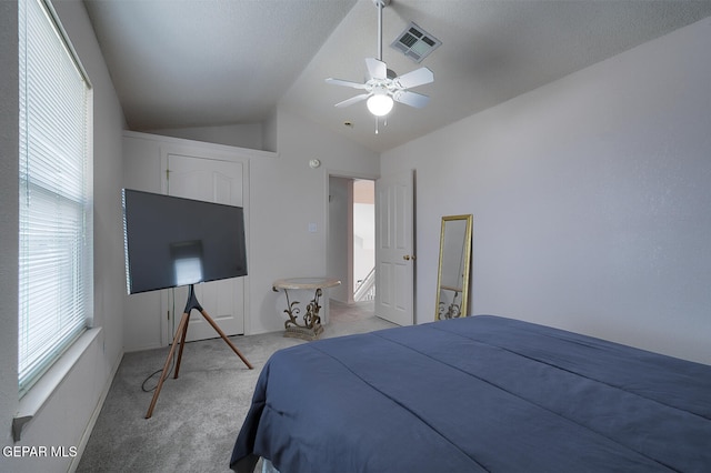 bedroom featuring lofted ceiling, carpet, and ceiling fan