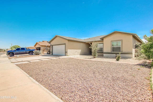 single story home featuring a garage