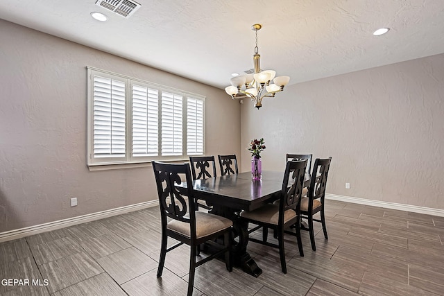 dining room with a notable chandelier