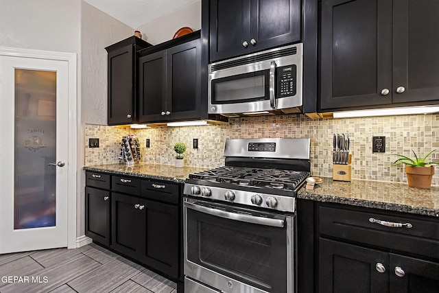 kitchen featuring light stone countertops, appliances with stainless steel finishes, and decorative backsplash