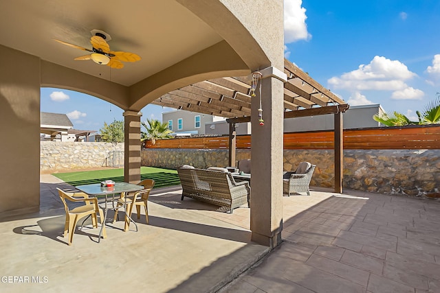 view of patio / terrace featuring an outdoor hangout area, ceiling fan, and a pergola