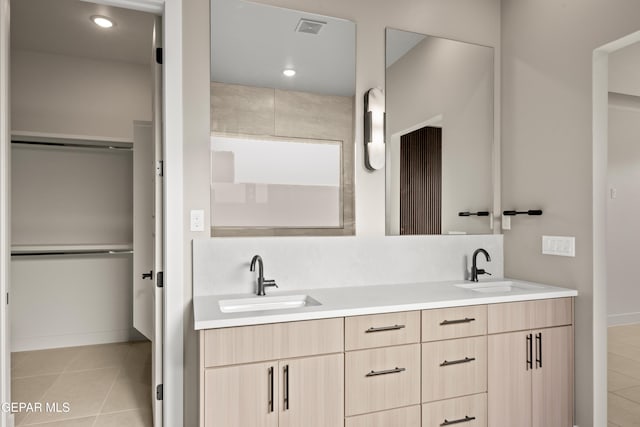 bathroom with tile patterned flooring and vanity