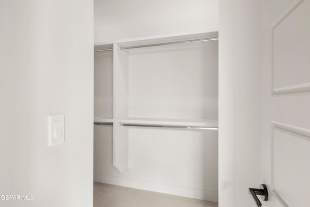 walk in closet featuring light tile patterned floors