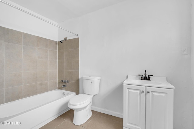 full bathroom featuring vanity, tiled shower / bath, tile patterned flooring, and toilet