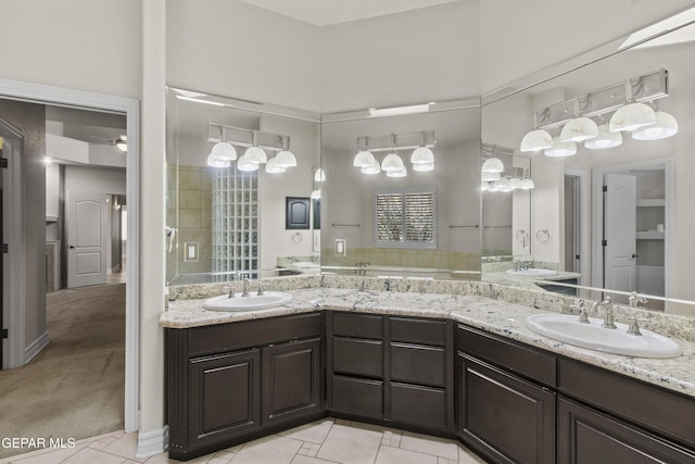 bathroom featuring tile patterned flooring, vanity, and ceiling fan