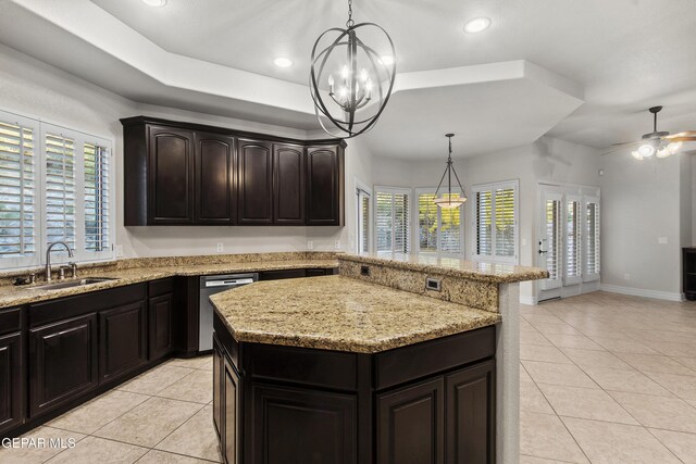 kitchen with sink, a center island, stainless steel dishwasher, decorative light fixtures, and ceiling fan with notable chandelier