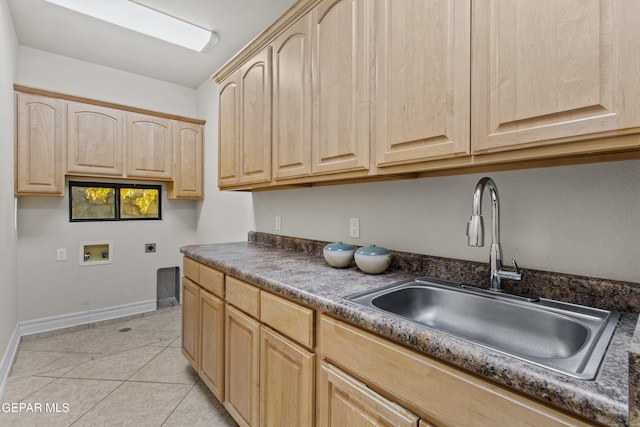 kitchen featuring light brown cabinets, light tile patterned floors, and sink