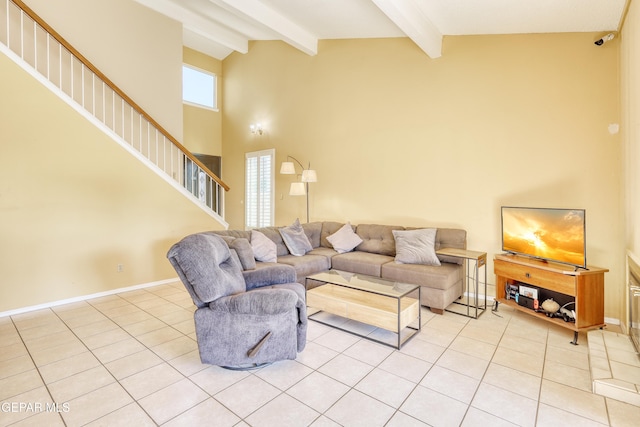 living room featuring beam ceiling, light tile patterned floors, and high vaulted ceiling