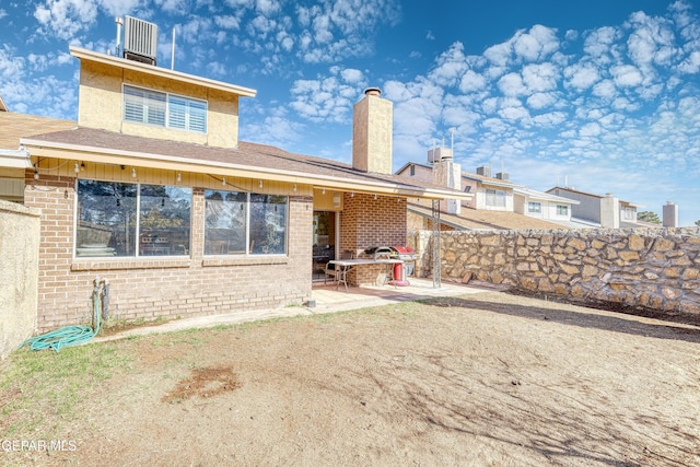 rear view of house featuring a patio area