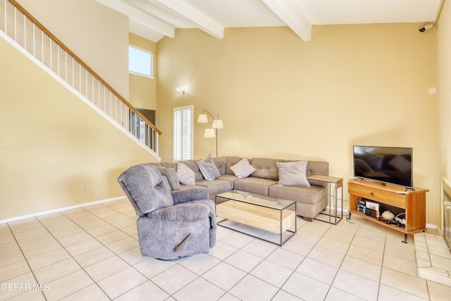 tiled living room featuring beamed ceiling and high vaulted ceiling