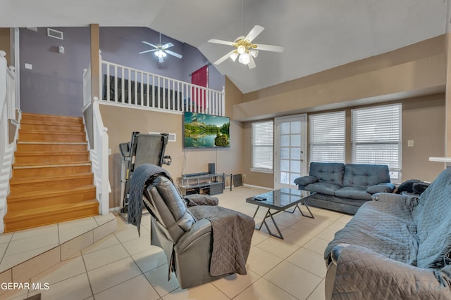 living room featuring ceiling fan, light tile patterned floors, and high vaulted ceiling