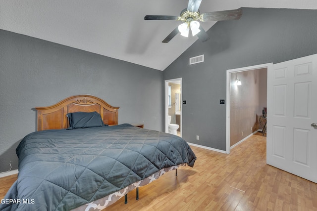 bedroom with connected bathroom, light hardwood / wood-style floors, high vaulted ceiling, and ceiling fan