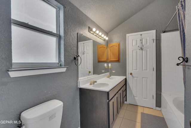 full bathroom featuring tub / shower combination, tile patterned floors, lofted ceiling, toilet, and a textured ceiling