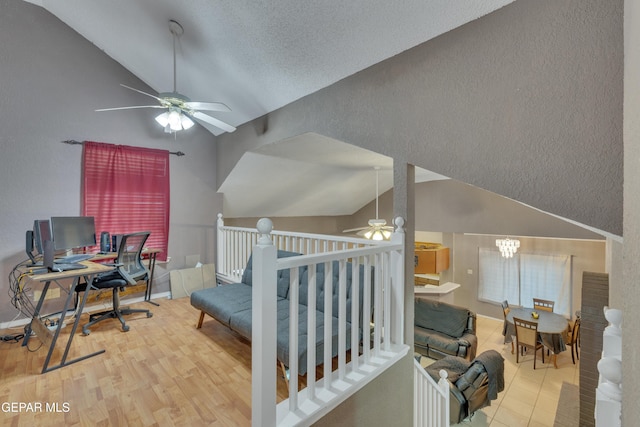 bedroom with light hardwood / wood-style flooring and lofted ceiling