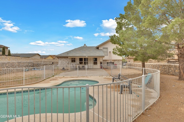 view of swimming pool featuring an in ground hot tub and a patio area