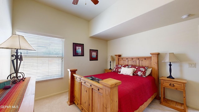 bedroom featuring light carpet and ceiling fan