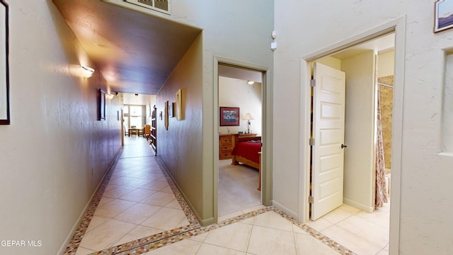 hallway featuring light tile patterned flooring