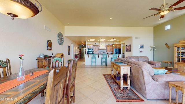 tiled living room with ceiling fan