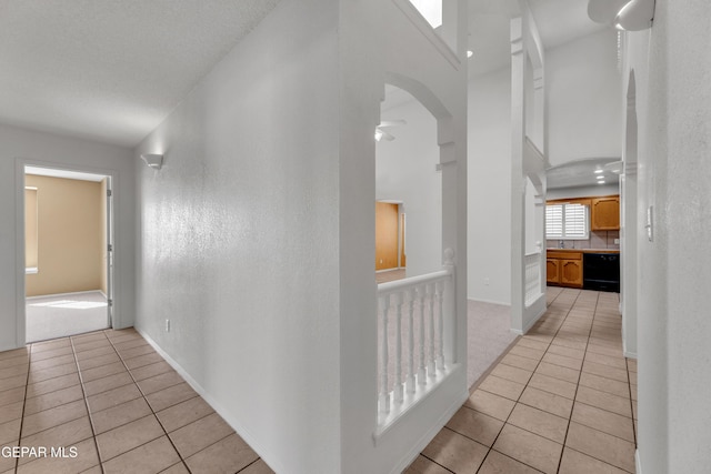 hallway with light tile patterned floors