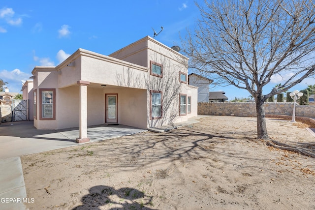 rear view of house featuring a patio area