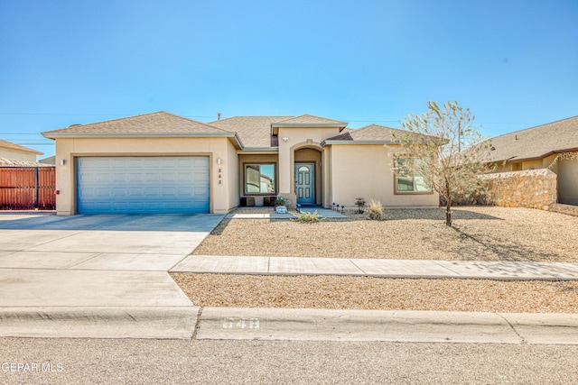 view of front of home with a garage