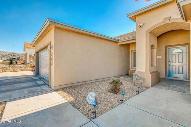 doorway to property featuring a garage