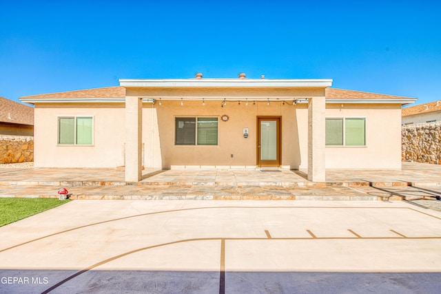 back of property featuring a patio