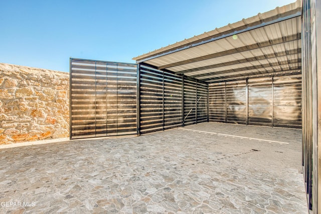 exterior space with a carport